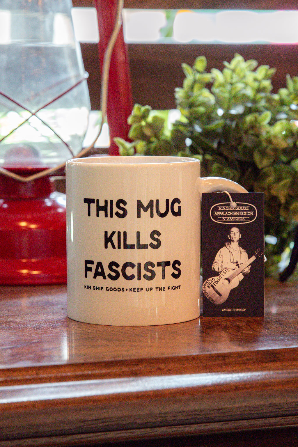 white mug with this mug kills fascists in black x Kin Ship Goods