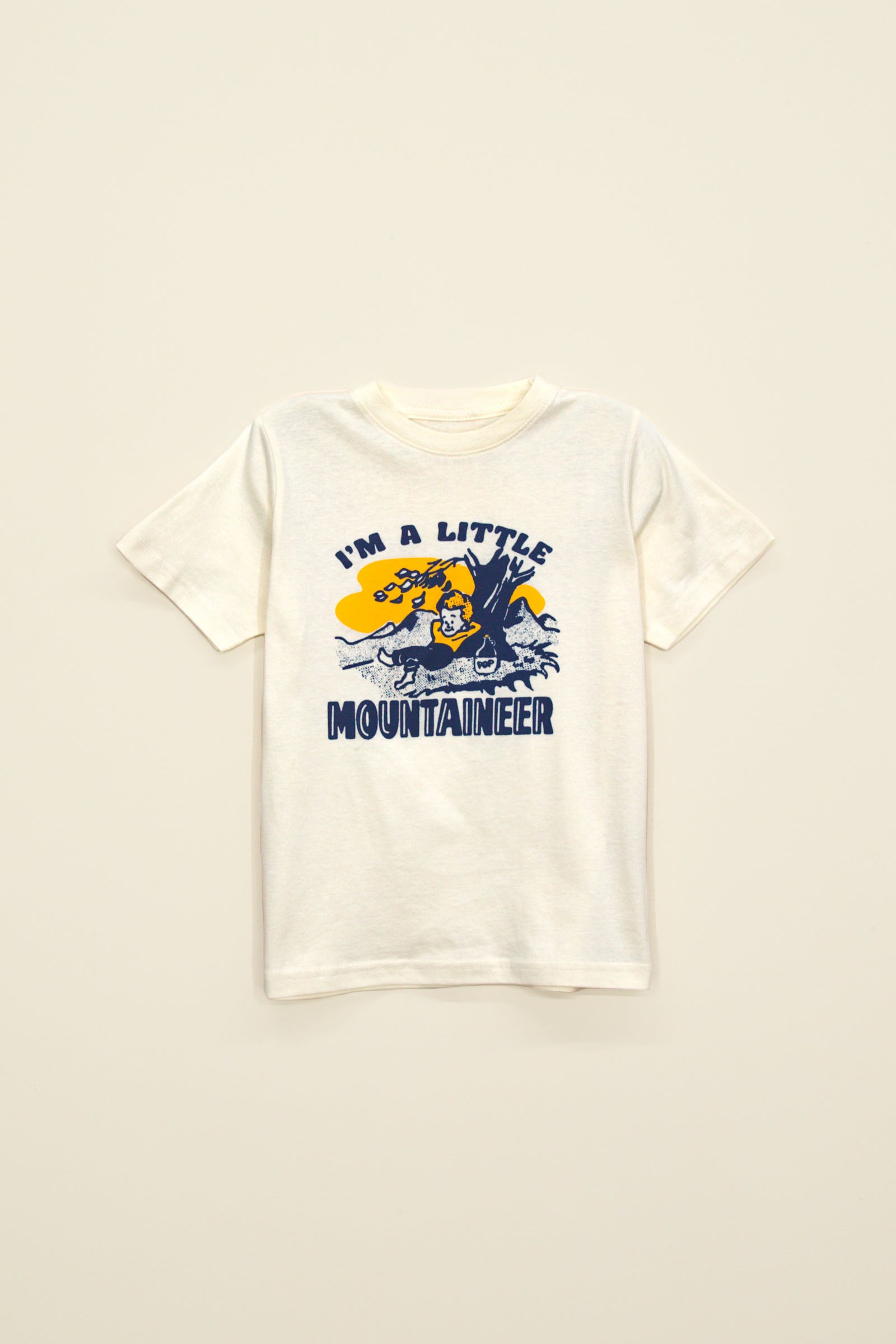 Kin Ship Goods kids tee in natural with blue and gold ‘I’m a Little Mountaineer’ graphic featuring a bear cub and mountain scene.